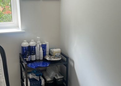 Skincare products on a shelf at Skinsbyygrace, Liverpool, England, GB, highlighting a peaceful beauty space.