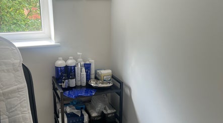 Skincare products on a shelf at Skinsbyygrace, Liverpool, England, GB, highlighting a peaceful beauty space.