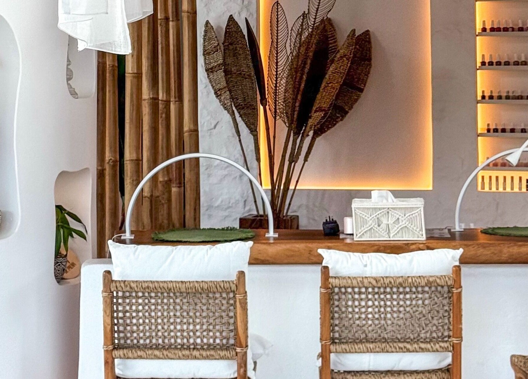 Elegant nail salon at De Palma Nail Spa in Makkah, Makkah Province, SA with wicker chairs and ambient lighting.