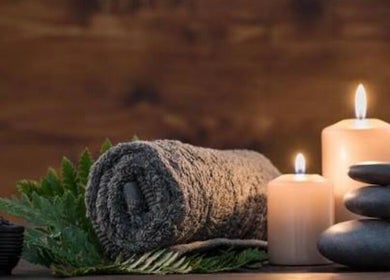 Calming spa setup with candles at Xiomara Wellness Massage in Farmington, Connecticut, US.