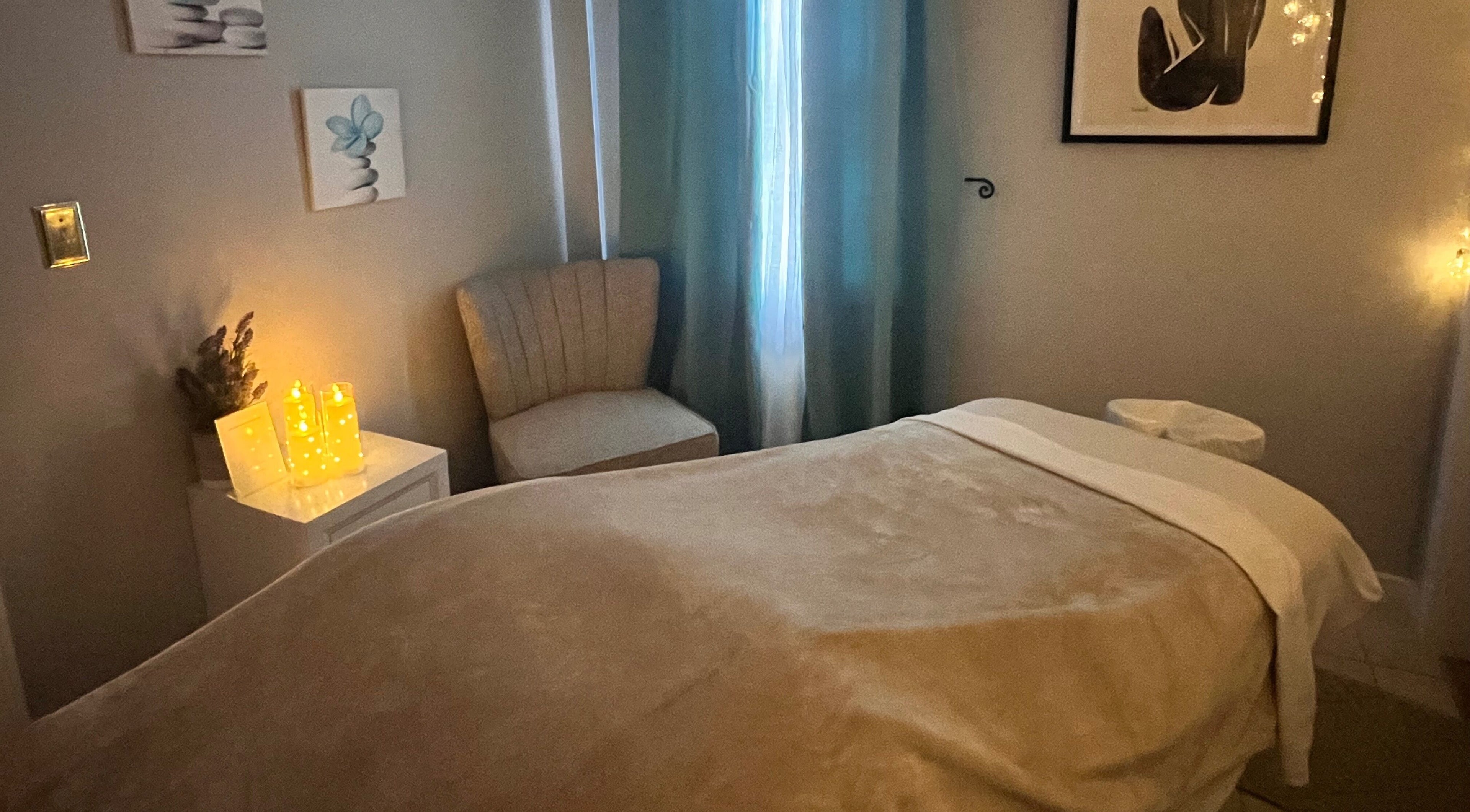 Relaxing massage room at Xiomara Wellness Massage, Avon, Connecticut, US with calming decor and ambient lighting.