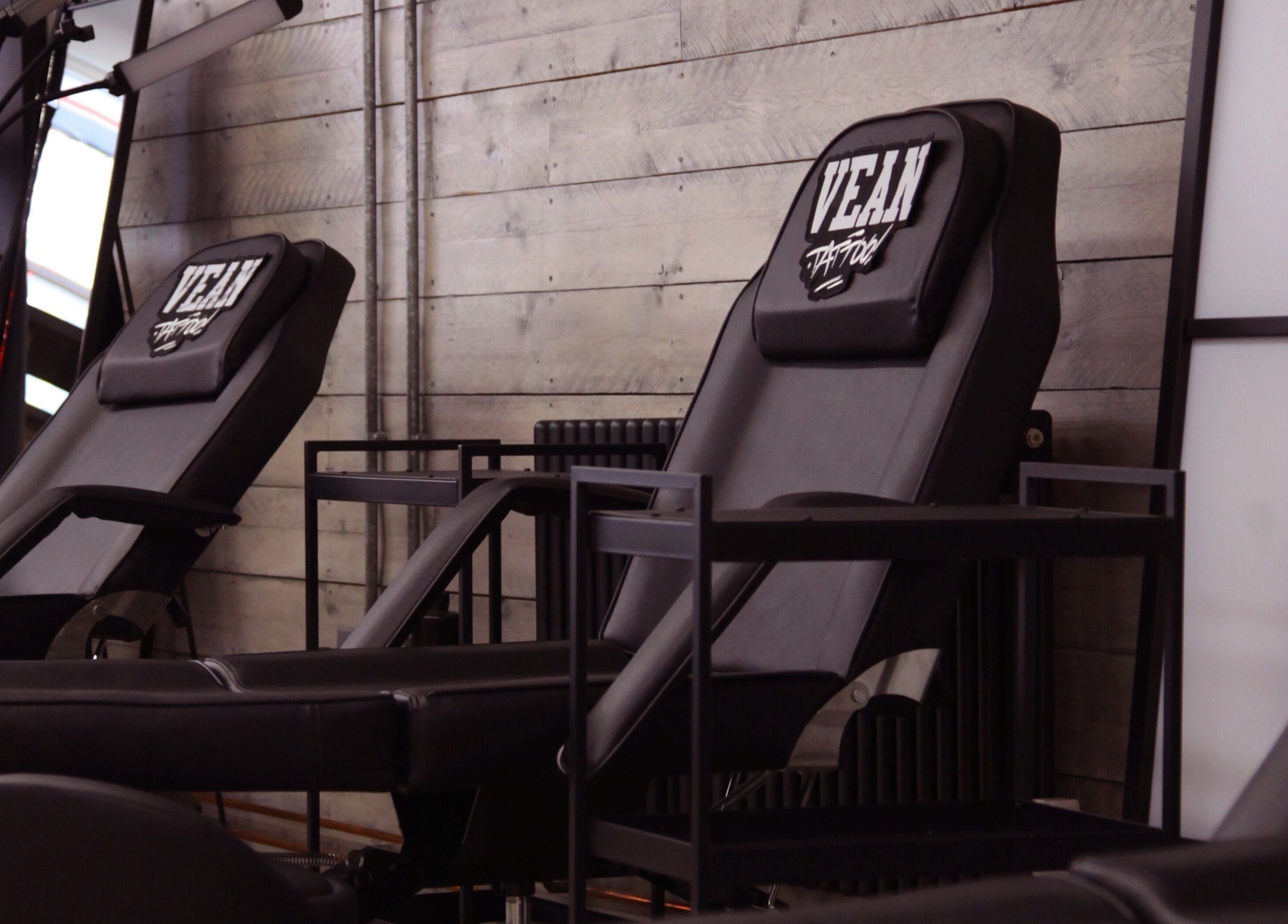 Professional tattoo chairs at VEAN TATTOO Bristol, providing comfort and quality service in Bristol, England, GB.