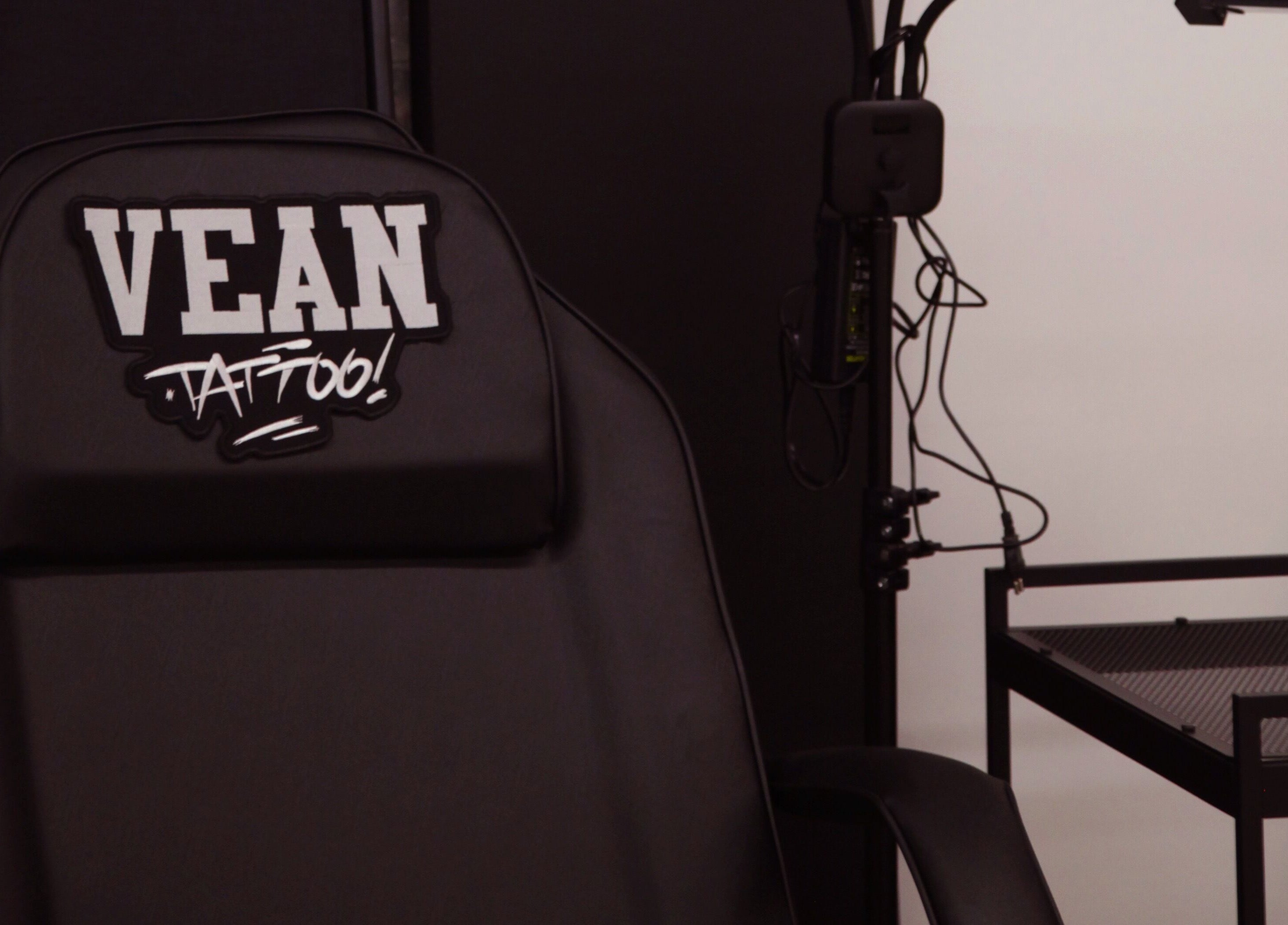 View of VEAN TATTOO Bristol's black tattoo chair and equipment setup in Bristol, England, GB.