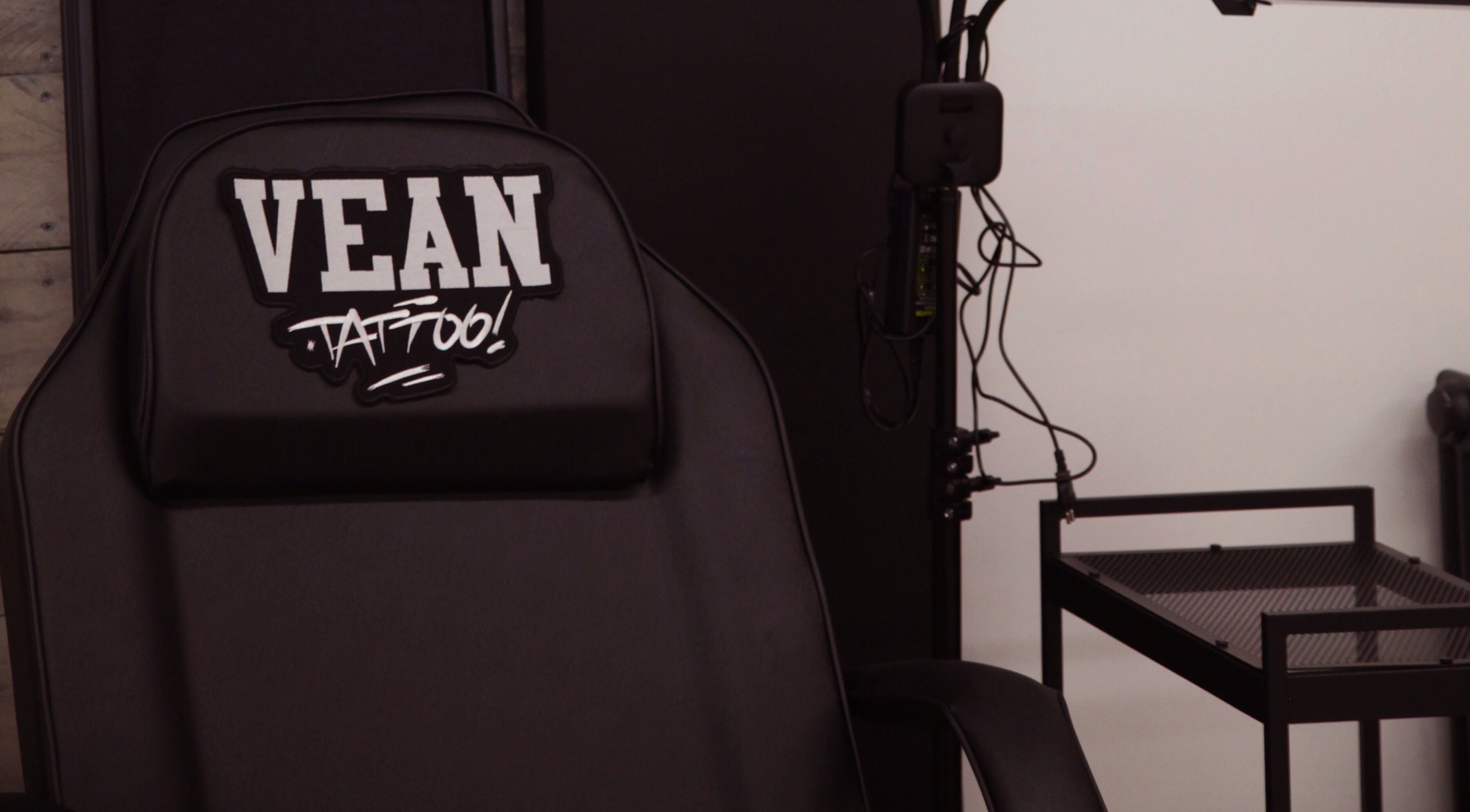 View of VEAN TATTOO Bristol's black tattoo chair and equipment setup in Bristol, England, GB.