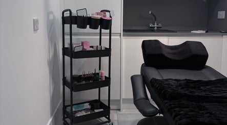 Sleek treatment chair and organized beauty supplies at Ova Beauty Bar, Banchory, Scotland, GB.