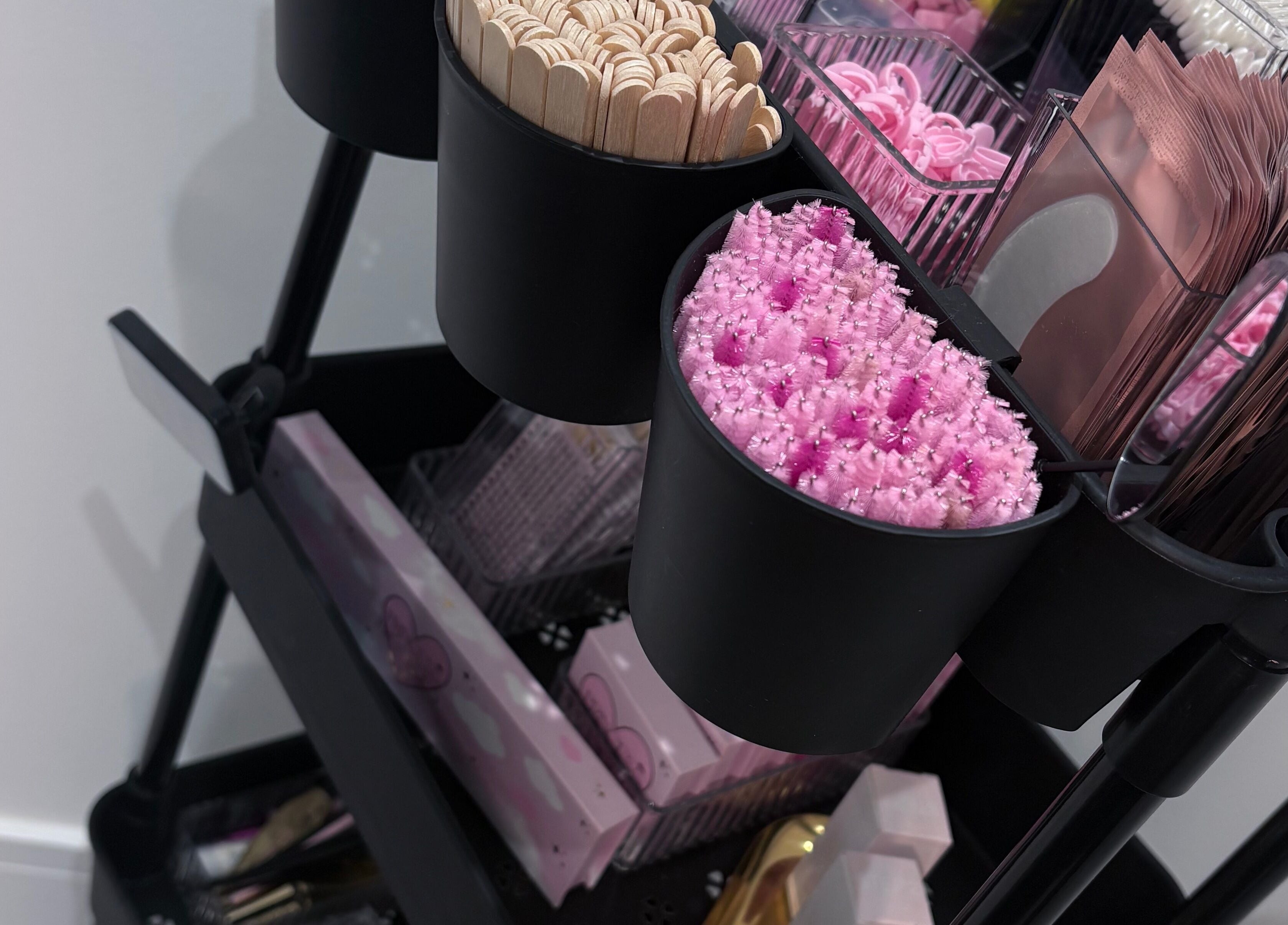 Beauty tools at Ova Beauty Bar in Banchory, Scotland, GB showcasing organized brushes and sticks.