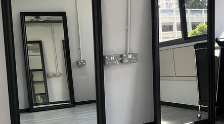 Sleek mirrors reflecting modern design at TL Hair Studio Sg, Singapore, Singapore, SG.