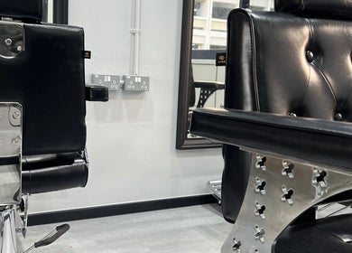 Stylish black barber chairs at TL Hair Studio Sg, Singapore, SG, showcasing modern salon design.