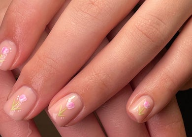 Close-up of floral nail art at Mabci, Glasgow, Scotland, GB, showcasing intricate pink flower designs.