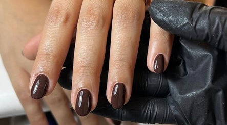 Polished nails with dark gloss at Mabci, Glasgow, Scotland, GB for a chic, stylish look.