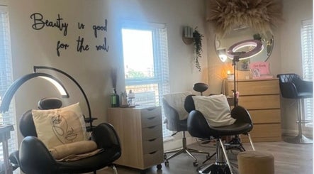 Cozy interior of Beauty By Nichola in Bromborough, England, GB, featuring comfortable chairs and elegant decor.