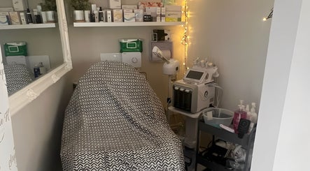 A cozy treatment room at Beauty By Nichola, Bromborough, England, GB, with modern beauty equipment and products.