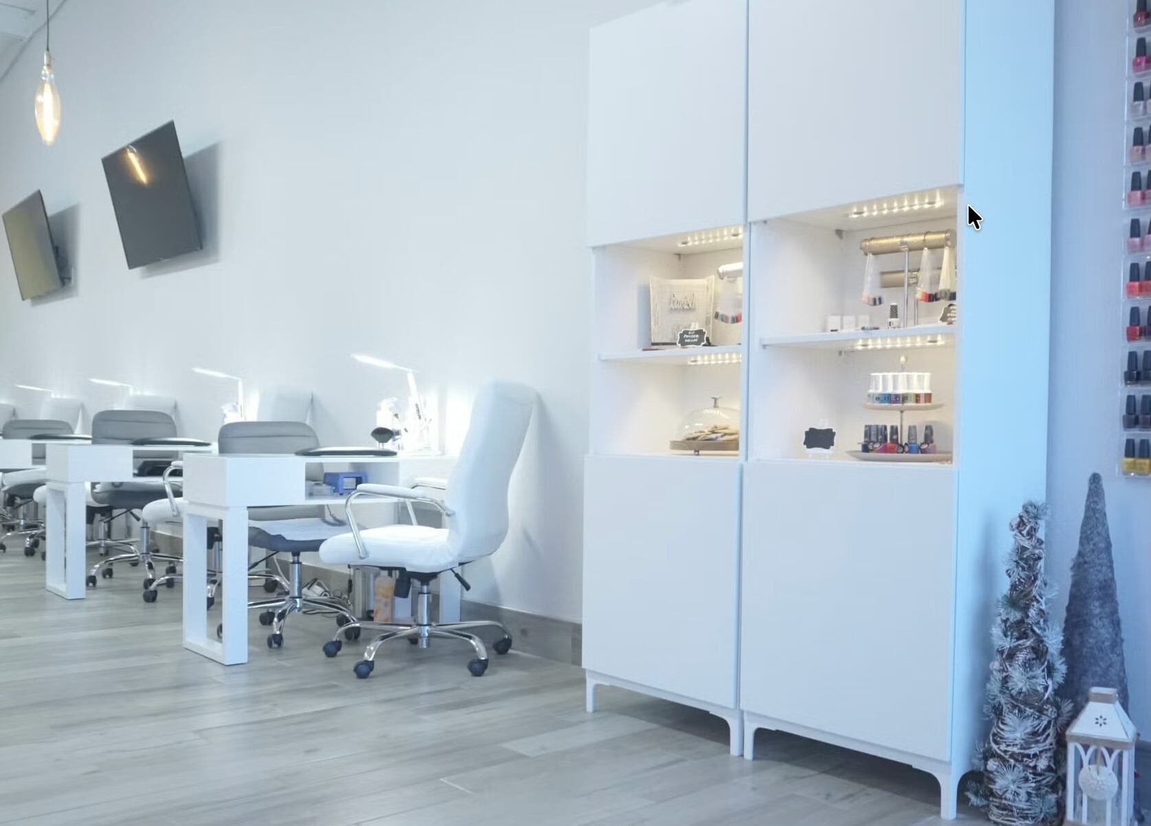 Elegant interior of Lavish Nails, Conroe, Texas, US with manicure stations and colorful nail polish display.