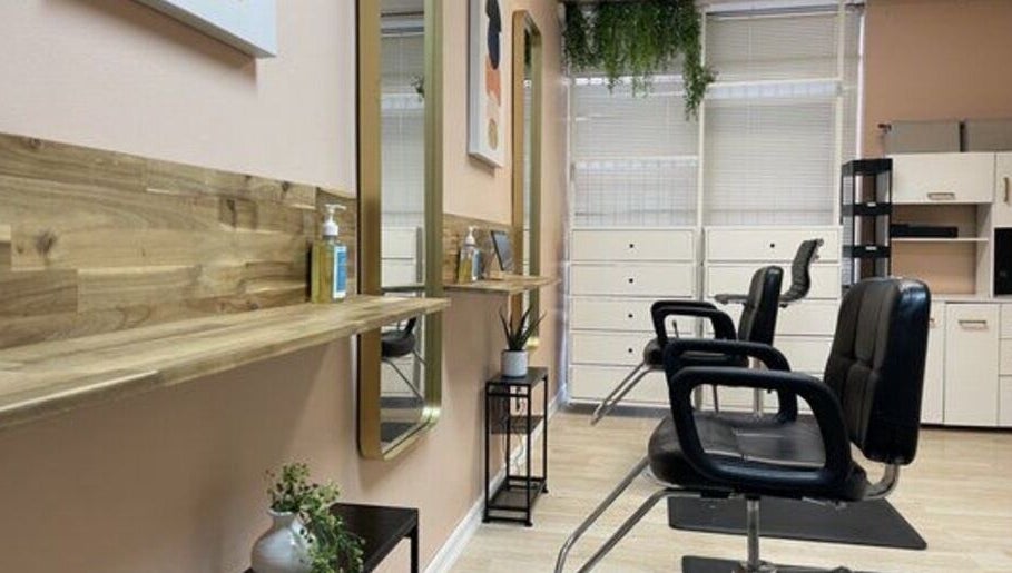 Quality Braids By Grace (AR) in Little Rock, Arkansas offers a modern, stylish salon interior with sleek chairs.