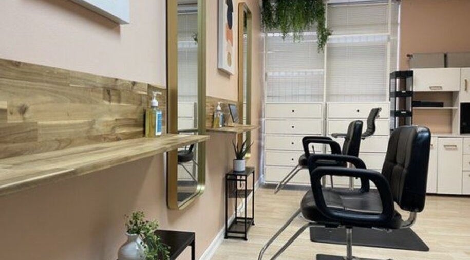 Stylish interior of Quality Braids By Grace (AR) in Little Rock, Arkansas, US with modern chairs and decor.