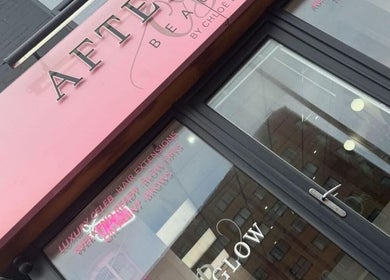 Exterior of LVL Lashes Blackpool, a beauty venue in Blackpool, England, GB with pink signage and glass doors.