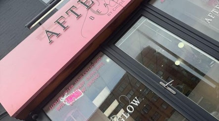 Exterior of LVL Lashes Blackpool, a beauty venue in Blackpool, England, GB with pink signage and glass doors.