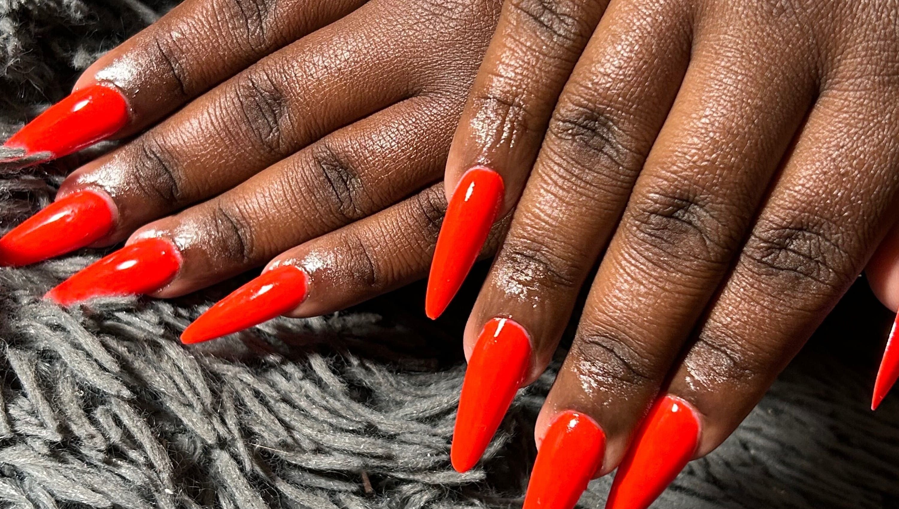 Vibrant red stiletto nails showcased at Kischa_co, Windhoek, Khomas Region, NA.