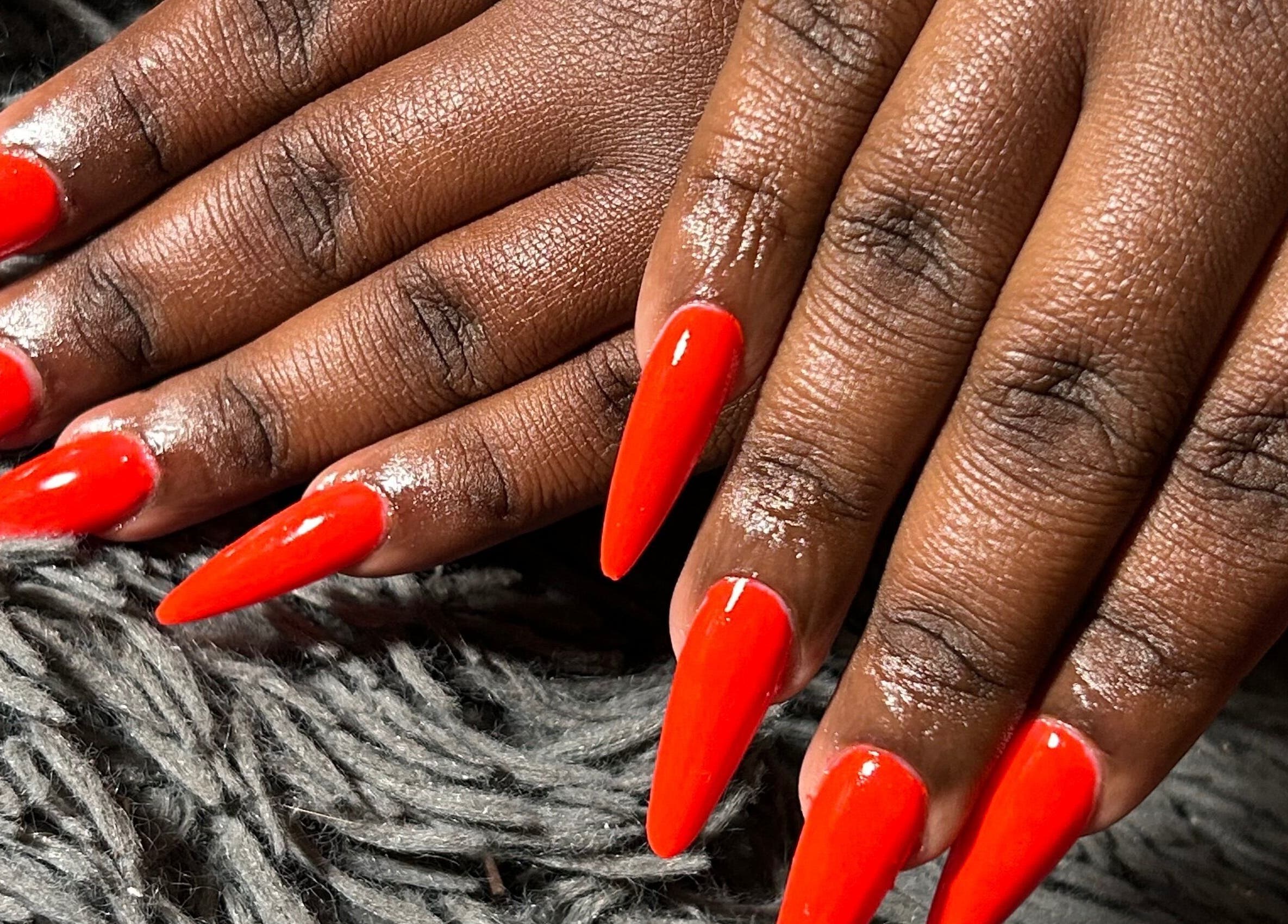 Vibrant red stiletto nails showcased at Kischa_co, Windhoek, Khomas Region, NA.