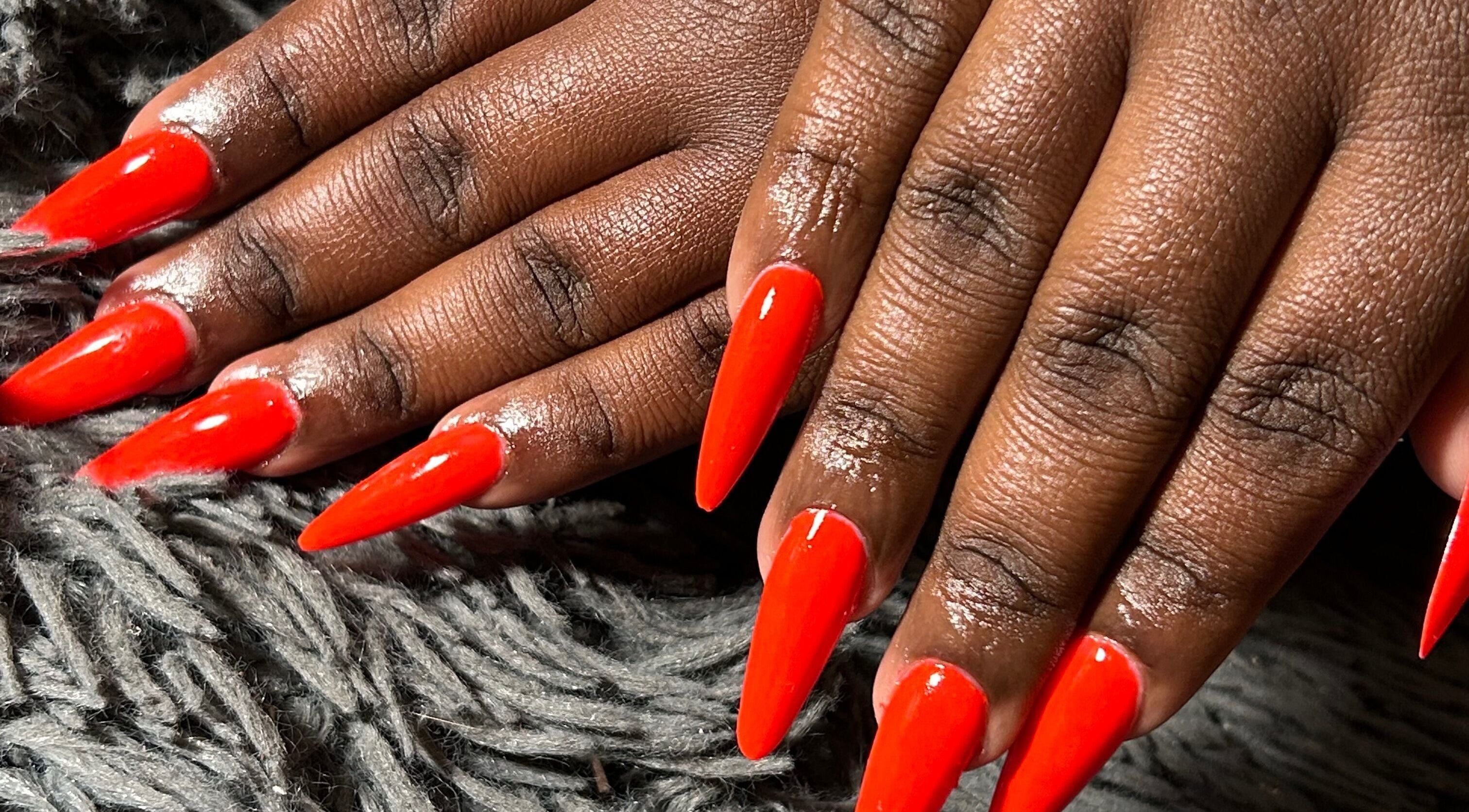 Vibrant red stiletto nails showcased at Kischa_co, Windhoek, Khomas Region, NA.