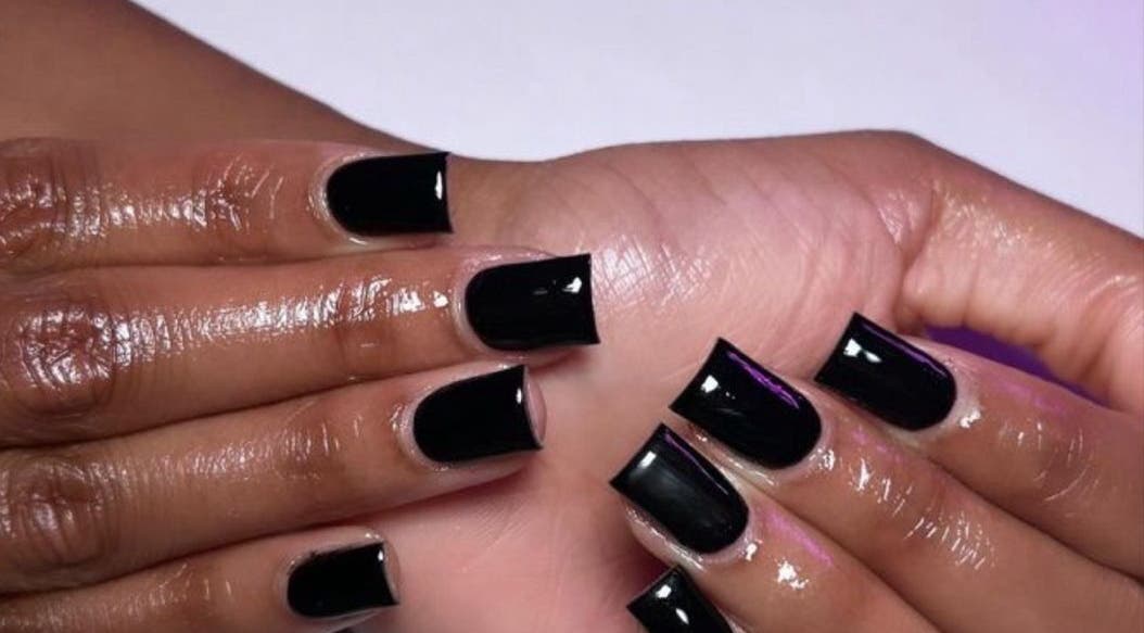Stylish black manicure at Kischa_co, Windhoek, Khomas Region, NA, showcasing glossy elegance.