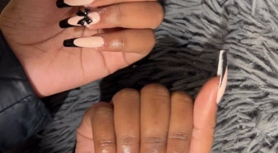 Elegant black-tipped nails with bow design at Kischa_co, Windhoek, Khomas Region, NA.