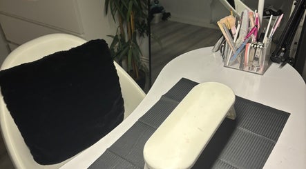 Nail station at Nailedbyjc in Grays, England, GB featuring tools and a cozy seating area.