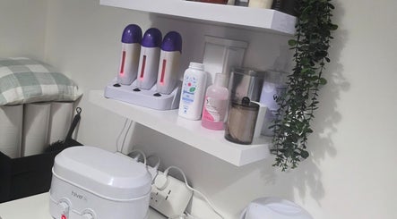 WaxByLora's waxing station in London, England, GB features neatly arranged waxing supplies and decor.