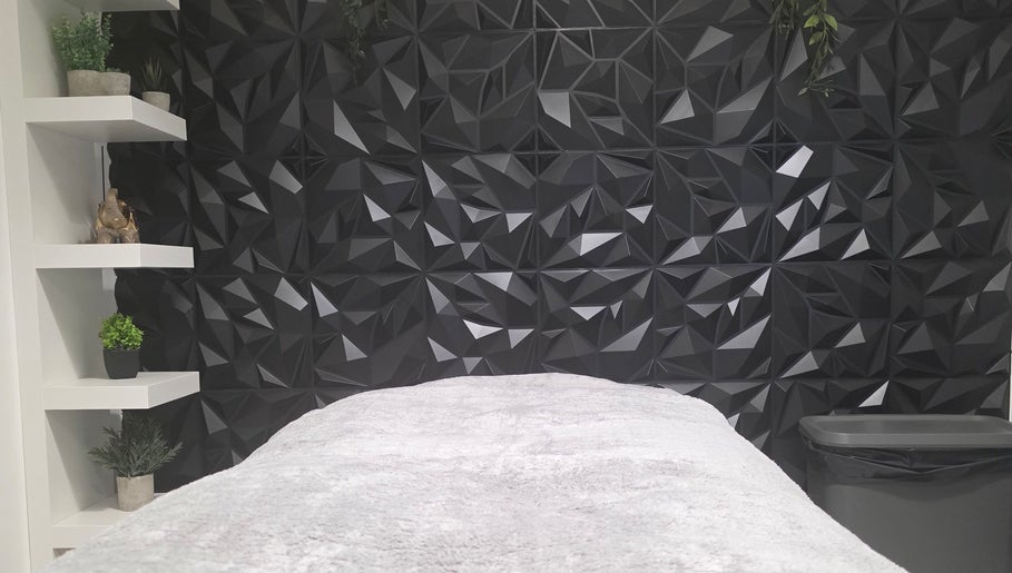 Elegant treatment room at WaxByLora, London, England, GB with geometric decor and sleek design.