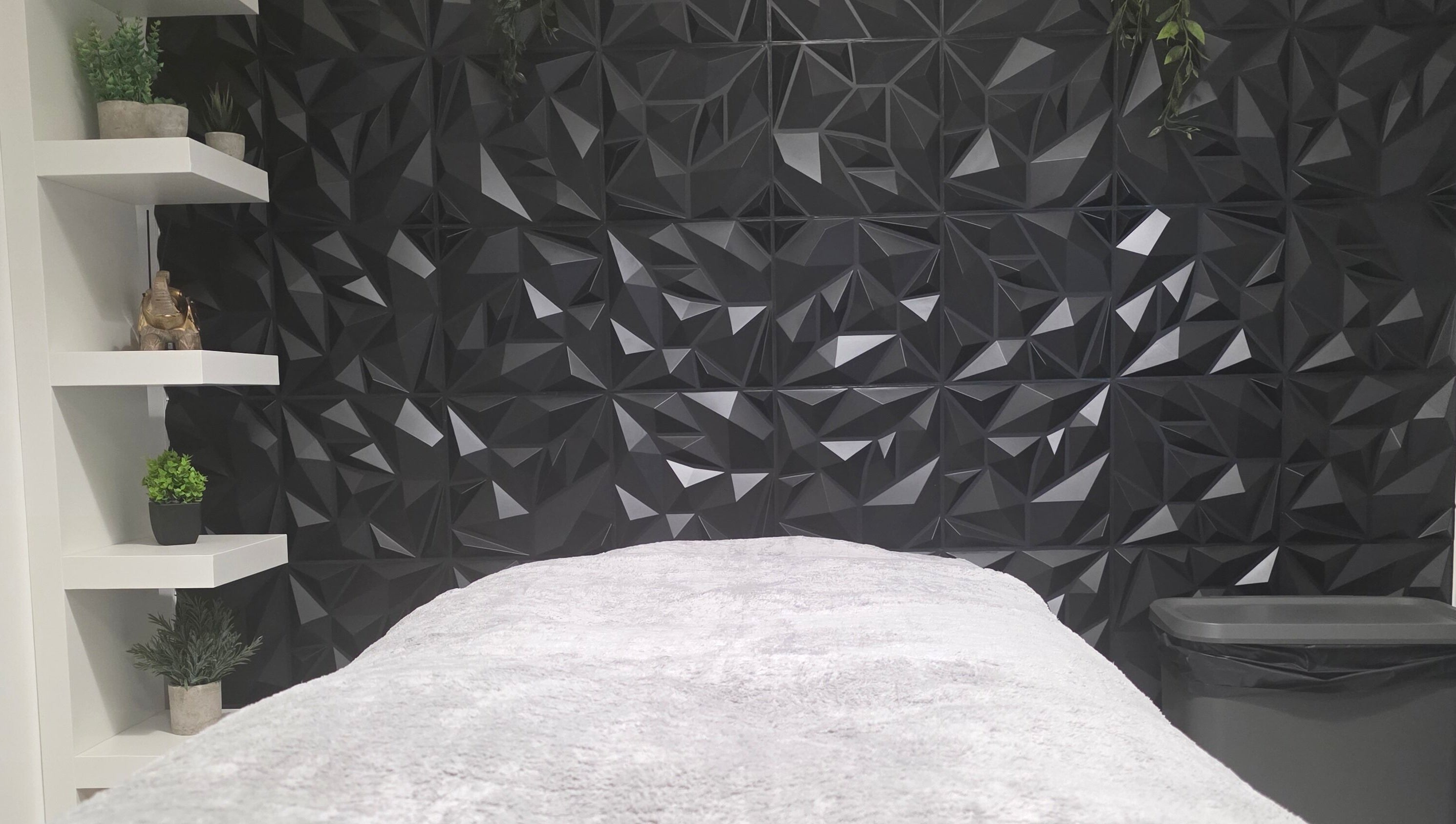 Elegant treatment room at WaxByLora, London, England, GB with geometric decor and sleek design.