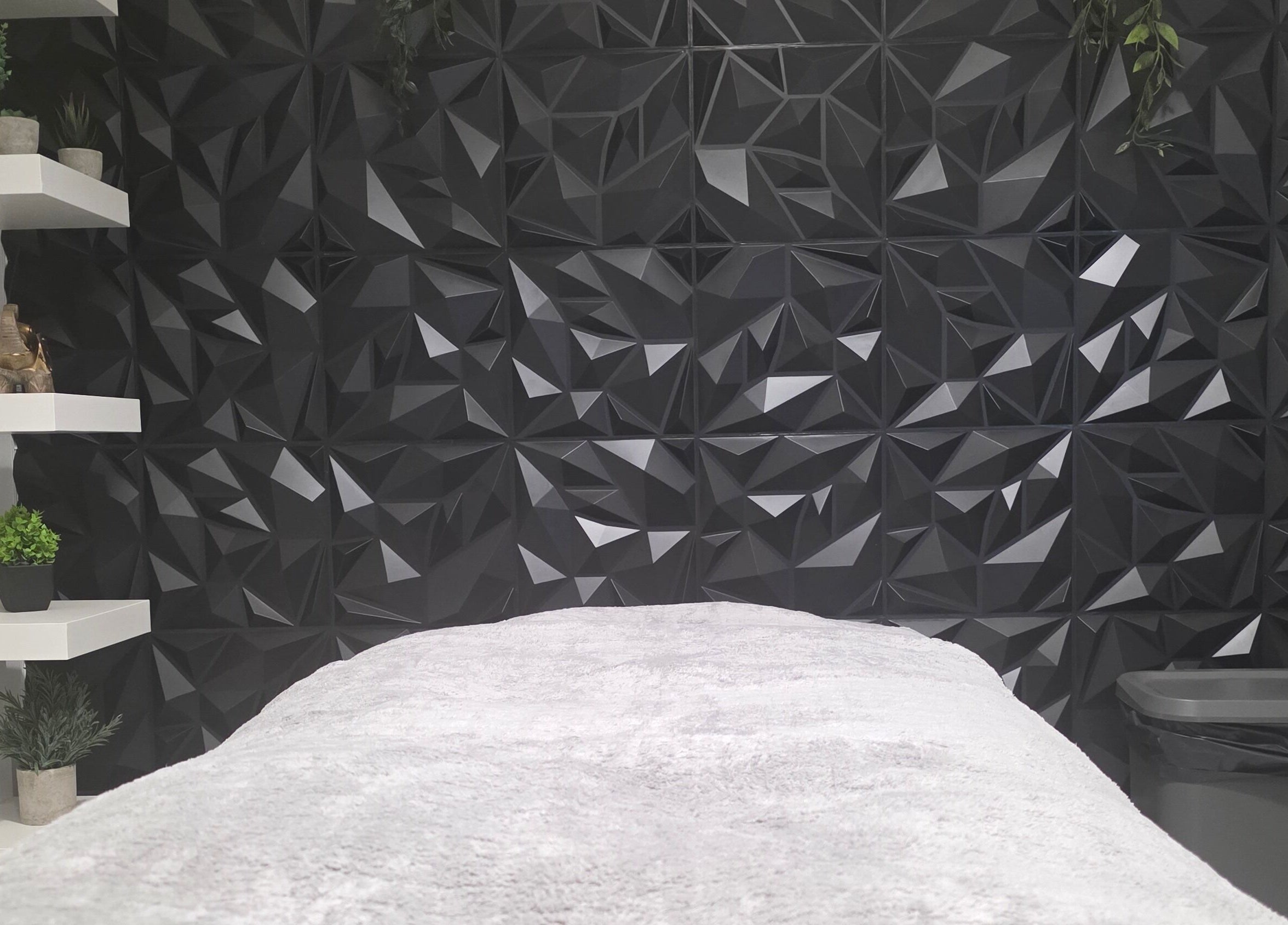 Elegant treatment room at WaxByLora, London, England, GB with geometric decor and sleek design.