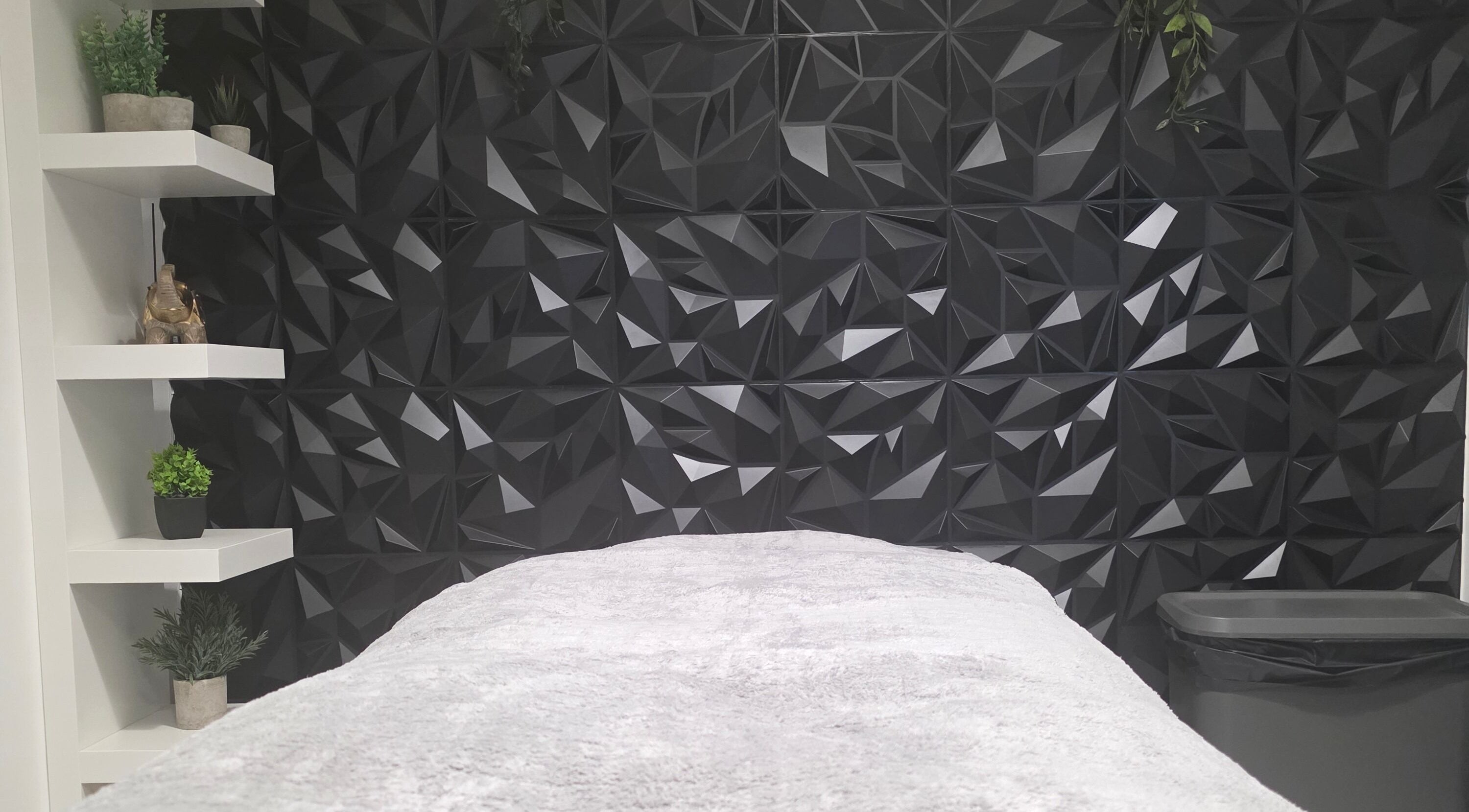 Elegant treatment room at WaxByLora, London, England, GB with geometric decor and sleek design.