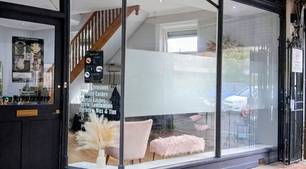 Exterior of Hair by Lorraine at Locks and Lashes Llanelli, featuring glass windows and stylish decor in Llanelli, Wales, GB.