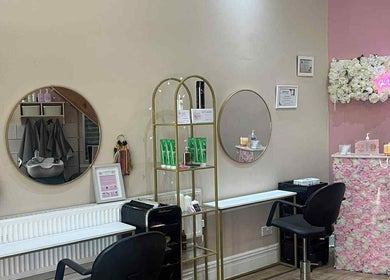 Stylish interior of Hair by Lorraine at Locks and Lashes Llanelli, Llanelli, Wales, GB with floral decor.