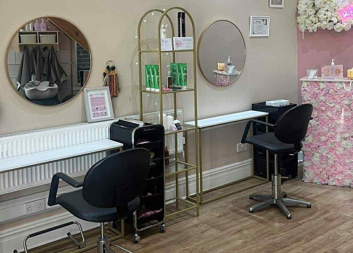 Modern salon interior at Hair by Lorraine, 5 The Arcade, Llanelli, Wales, GB, featuring stylish decor and seating.