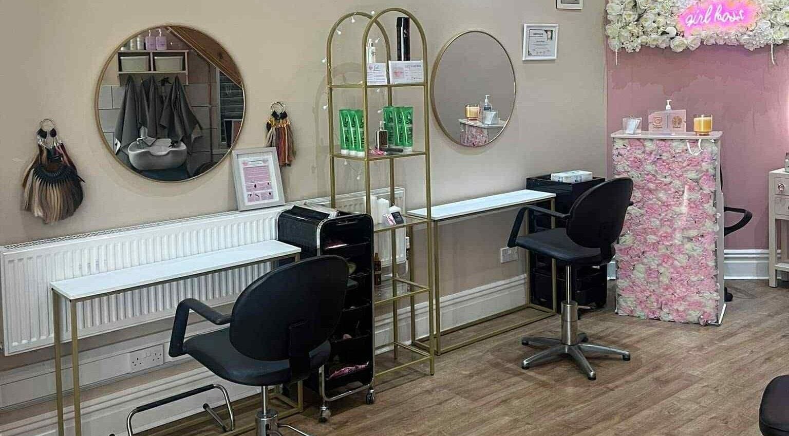 Modern salon interior at Hair by Lorraine, 5 The Arcade, Llanelli, Wales, GB, featuring stylish decor and seating.