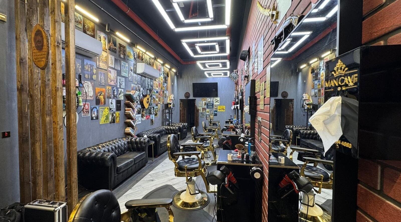 Interior of MAN CAVE SALON, Doha, showcasing luxurious seating and decor.