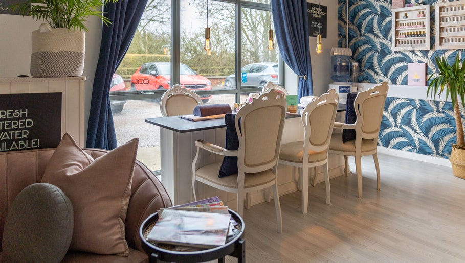 Elegant seating area at Morgan and Company Hair and Beauty, Nottingham, England, GB with stylish decor.