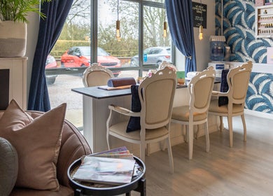 Elegant seating area at Morgan and Company Hair and Beauty, Nottingham, England, GB with stylish decor.