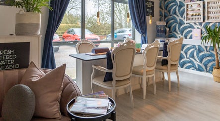 Elegant seating area at Morgan and Company Hair and Beauty, Nottingham, England, GB with stylish decor.