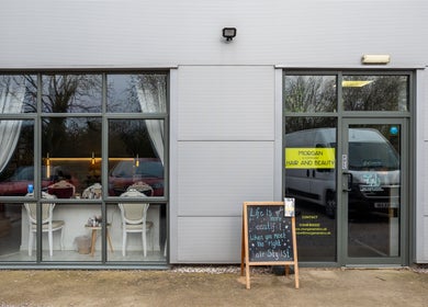 Entrance of Morgan and Company Hair and Beauty in Nottingham, England featuring stylish exterior and signage.
