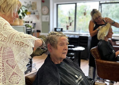 Stylists at Morgan and Company Hair and Beauty in Nottingham, England, GB create elegant hair designs.