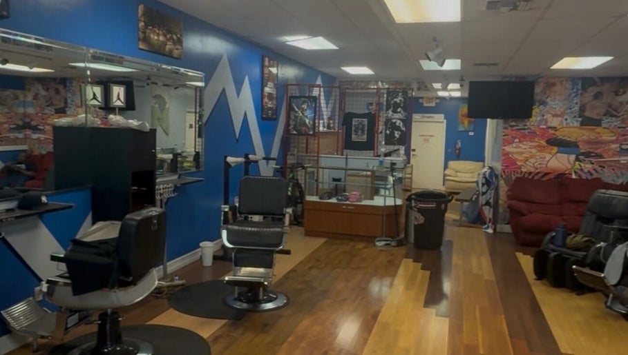 Interior of KROWNED by P, a vibrant beauty salon in Tamarac, Florida, US with stylish chairs and colorful decor.
