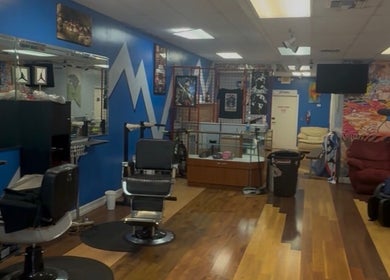 Interior of KROWNED by P, a vibrant beauty salon in Tamarac, Florida, US with stylish chairs and colorful decor.