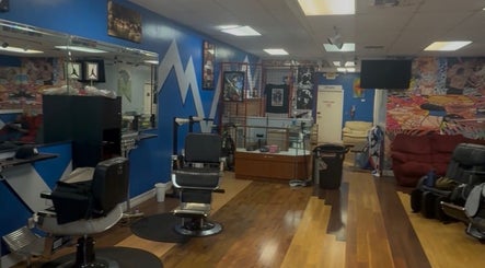 Interior of KROWNED by P, a vibrant beauty salon in Tamarac, Florida, US with stylish chairs and colorful decor.