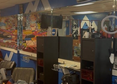 Colorful salon interior at KROWNED by P, Tamarac, Florida, US, featuring modern decor and wall art.