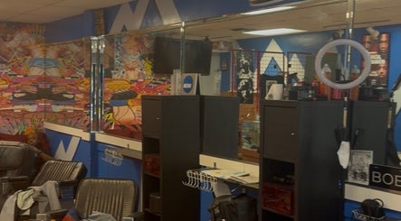 Colorful salon interior at KROWNED by P, Tamarac, Florida, US, featuring modern decor and wall art.