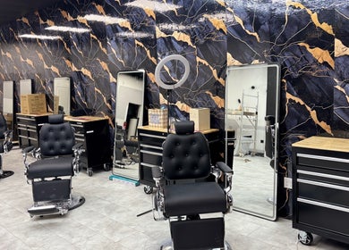 Chic salon interior at Bedford (Sunnyside Mall), Bedford, Nova Scotia, CA featuring stylish black chairs.