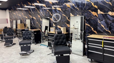 Chic salon interior at Bedford (Sunnyside Mall), Bedford, Nova Scotia, CA featuring stylish black chairs.