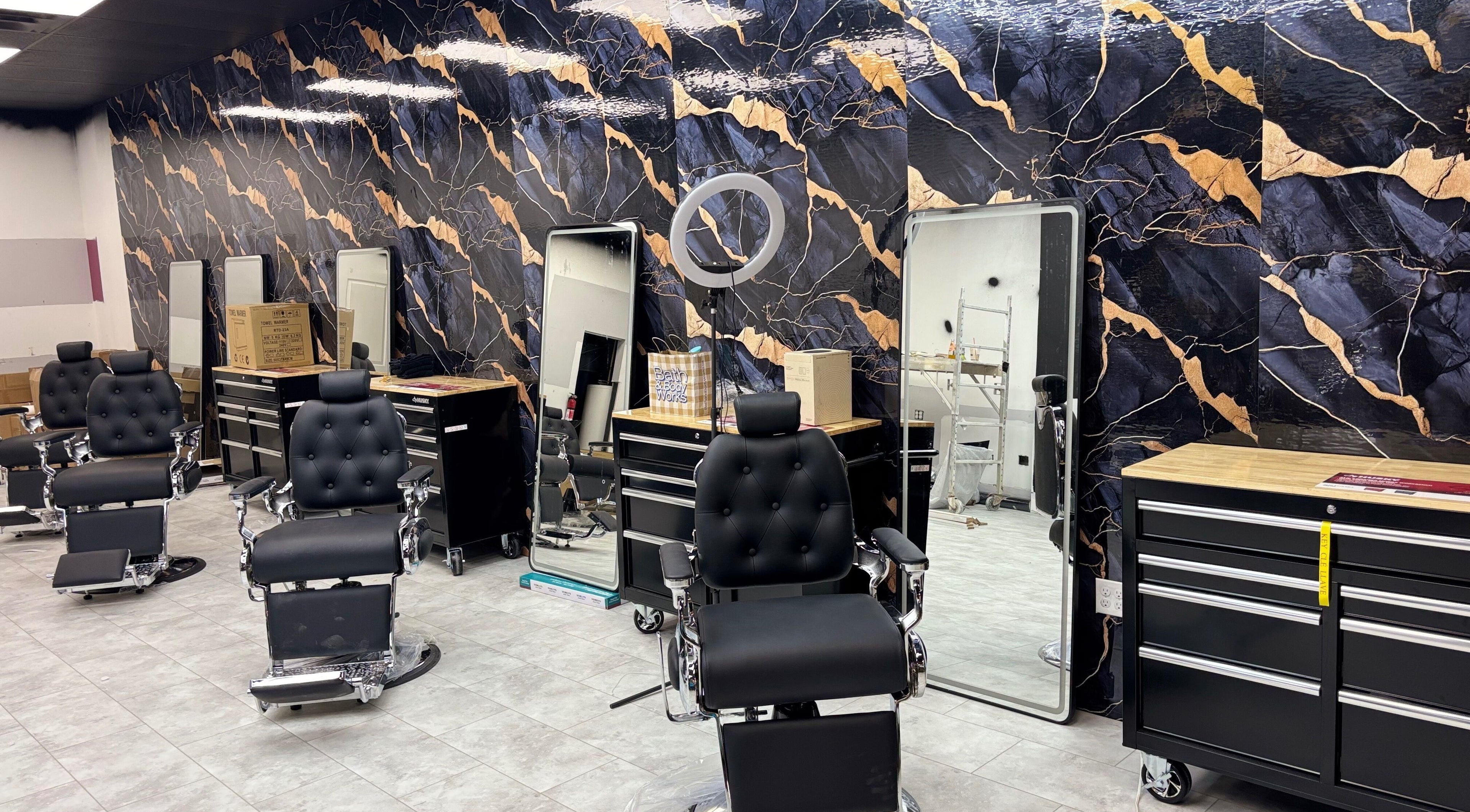 Chic salon interior at Bedford (Sunnyside Mall), Bedford, Nova Scotia, CA featuring stylish black chairs.